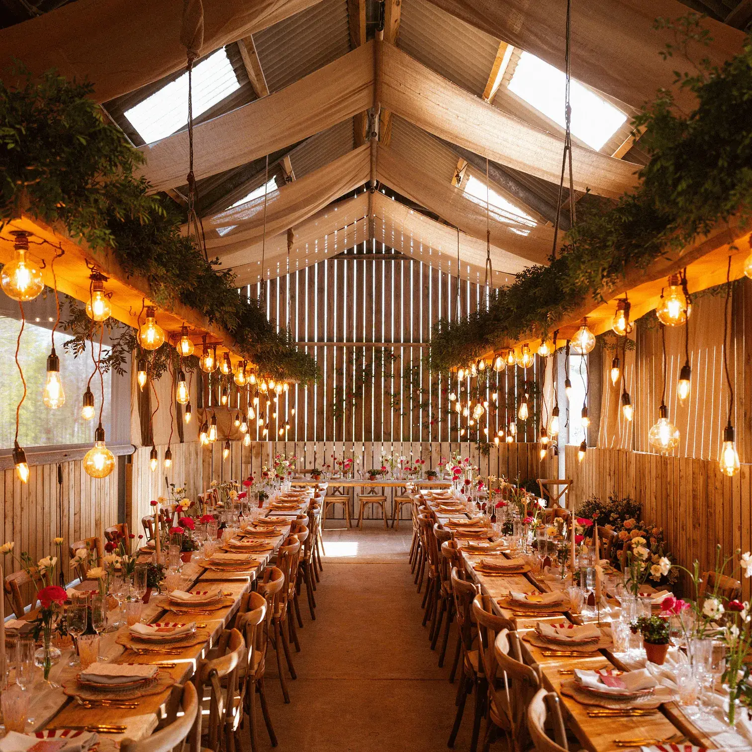 Long banquet tables set for a wedding reception at Everards Farm